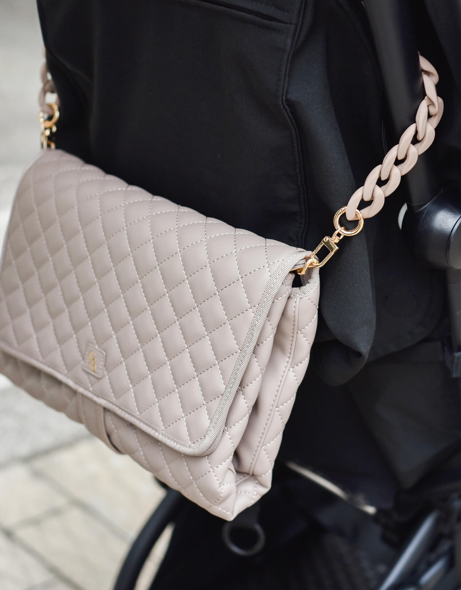 Diaper bag with strap on stroller